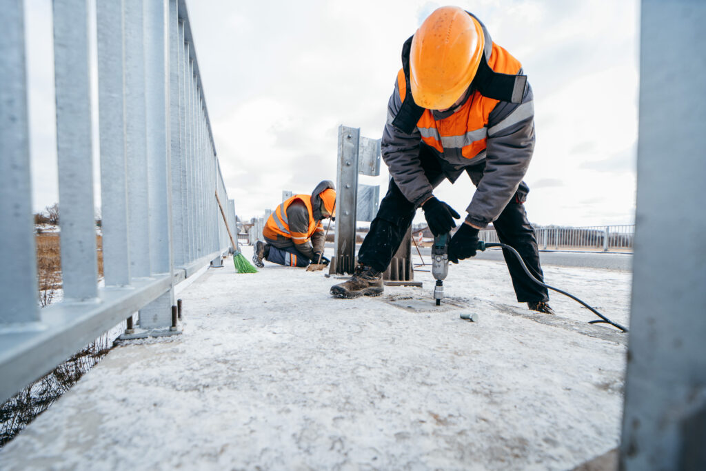 Road construction worker in winter