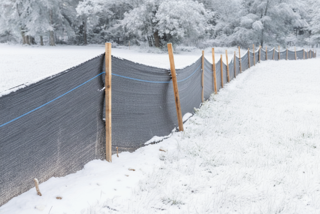 slit fencing on a construction site in winter