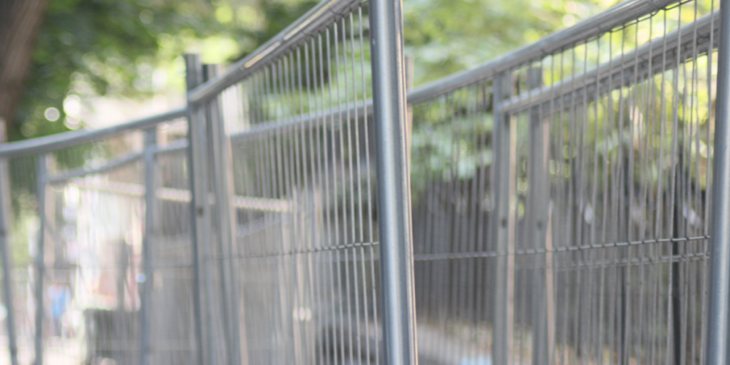temporary fence panel gap on a construction site